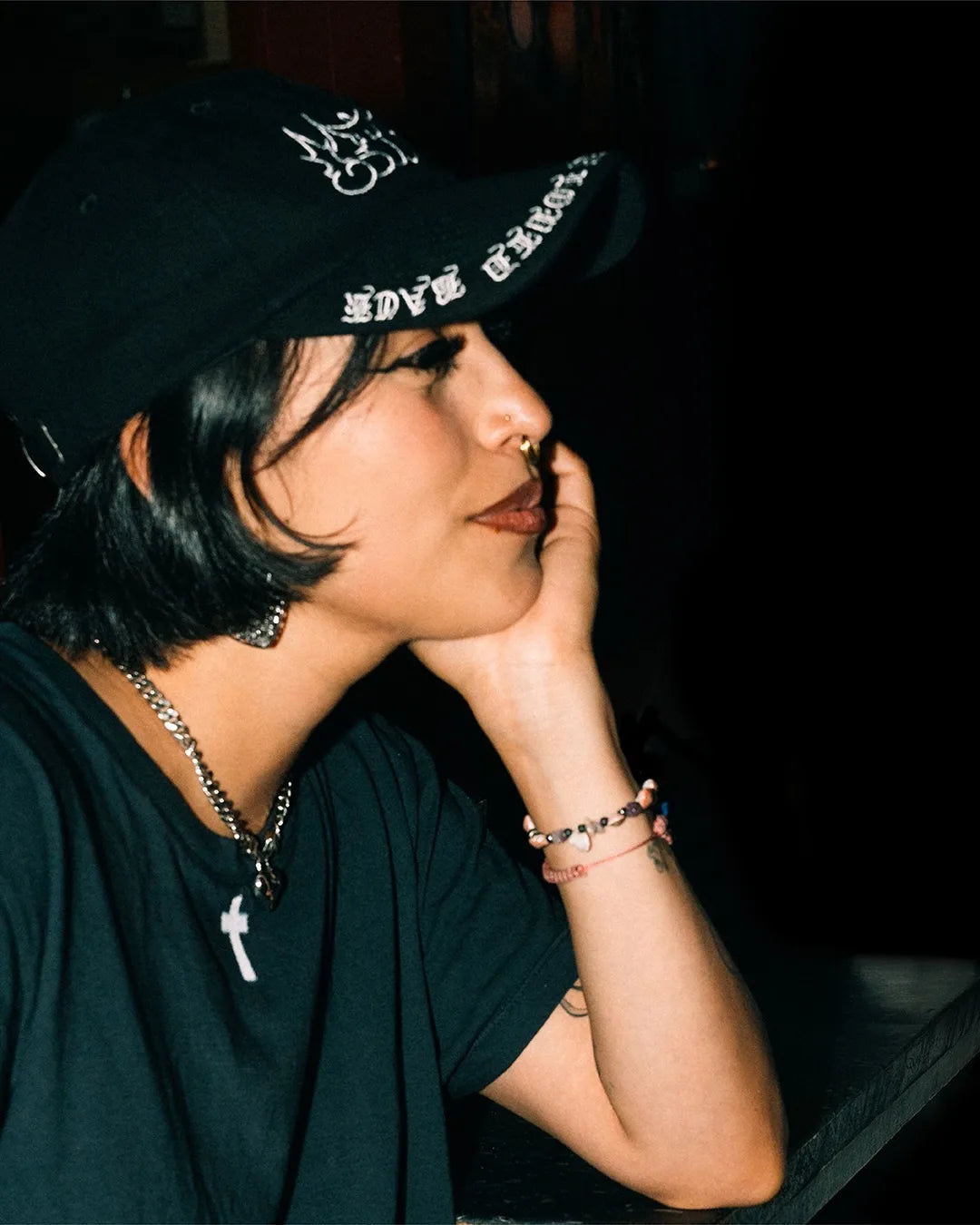 Campaign: a woman in the Padre Black hat, side profile
